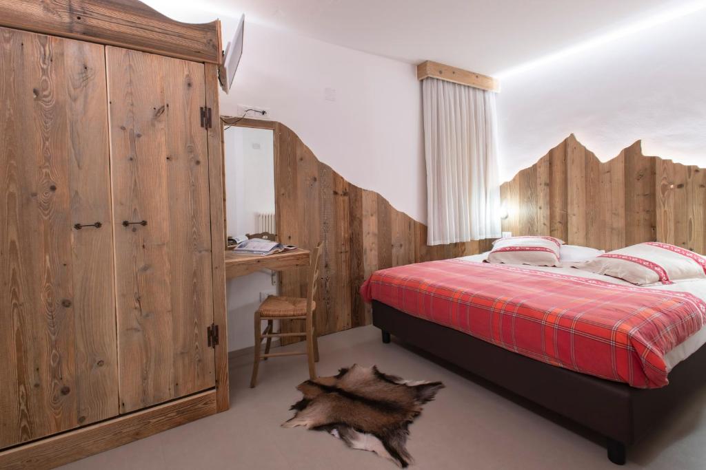 Postel nebo postele na pokoji v ubytování Hotel Pezzotti