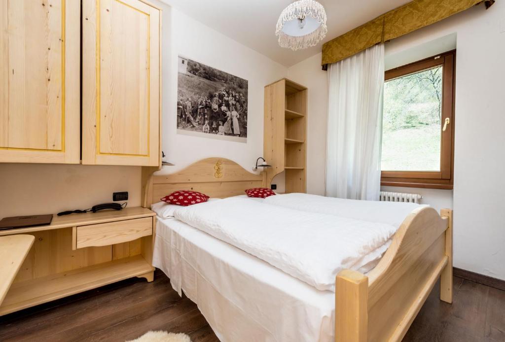 Postel nebo postele na pokoji v ubytování Hotel Pezzotti