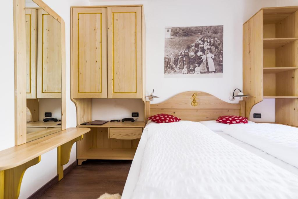 Postel nebo postele na pokoji v ubytování Hotel Pezzotti