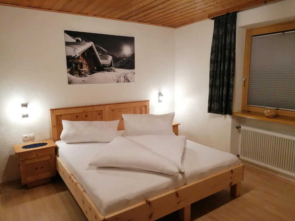 מיטה או מיטות בחדר ב-Mooshof