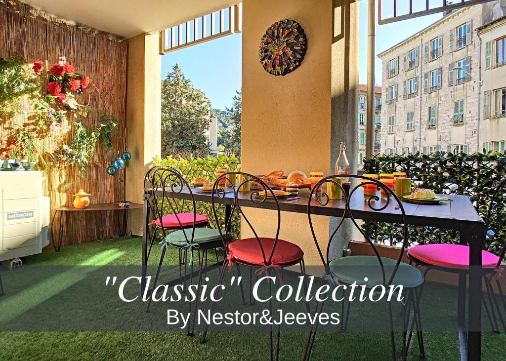 a patio with a table and chairs on a balcony at Nestor&Jeeves - CIGALUSA TERRASSE - Port area - Close Old Town in Nice
