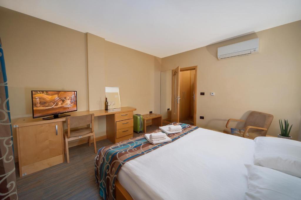 Postel nebo postele na pokoji v ubytování Hotel Malovec