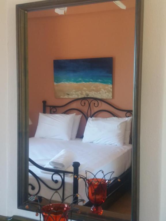 Postel nebo postele na pokoji v ubytování Dionisis Apartments
