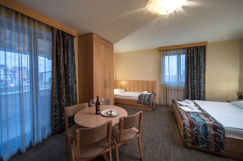 Postel nebo postele na pokoji v ubytování Hotel Malovec