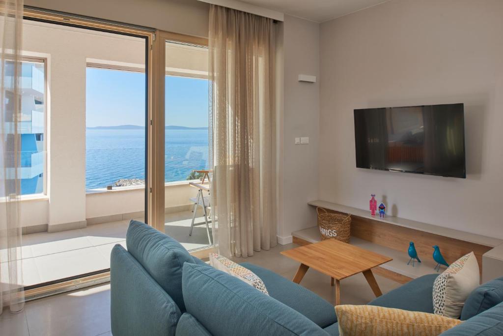 Televízia a/alebo spoločenská miestnosť v ubytovaní Eol Apartments Split