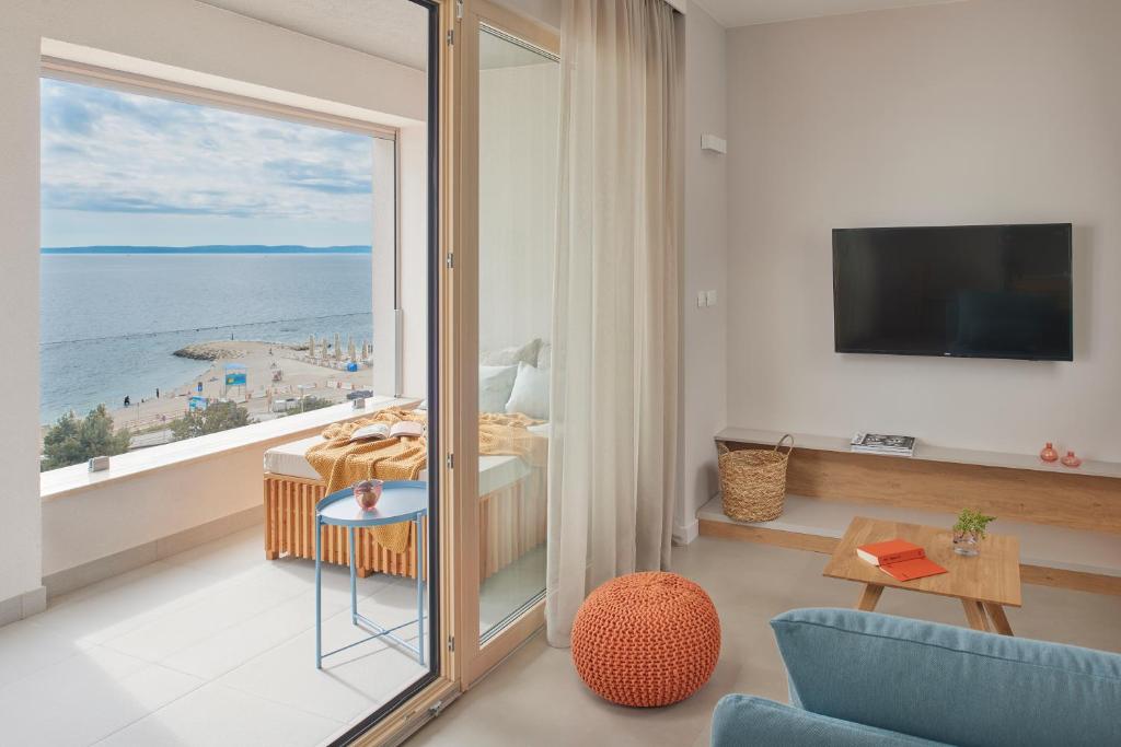 Televízia a/alebo spoločenská miestnosť v ubytovaní Eol Apartments Split