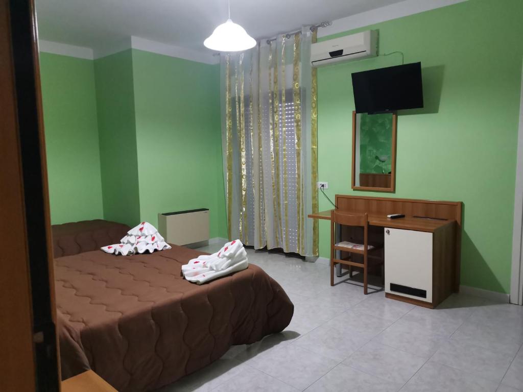 Postel nebo postele na pokoji v ubytování Hotel Park Grumentum