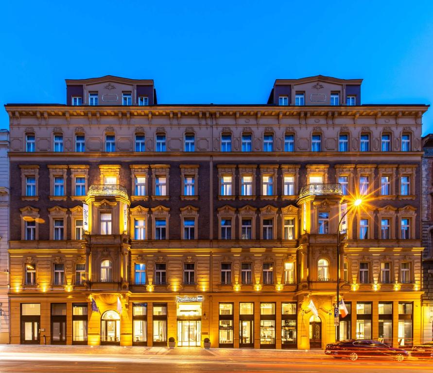 a large building in front of a street at Radisson Blu Hotel Prague in Prague
