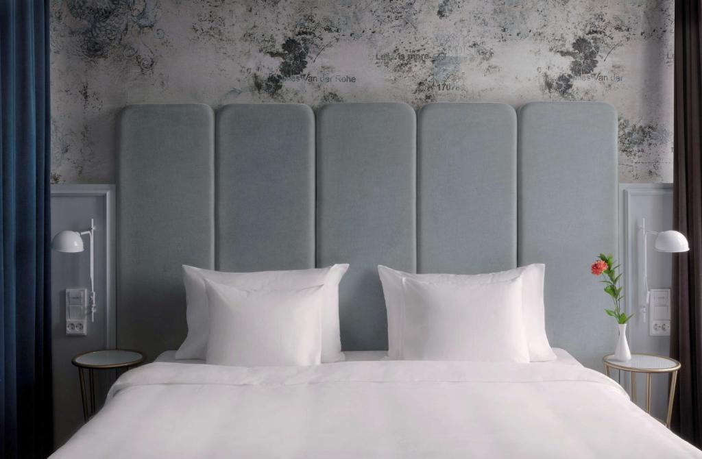 a bedroom with a large bed with white pillows at Radisson Blu Seaside Hotel, Helsinki in Helsinki