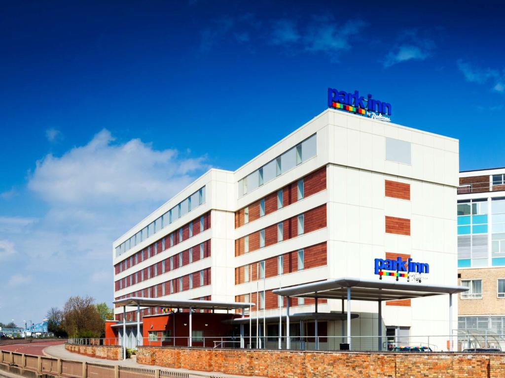 
a large building with a sign on the side of it at Park Inn by Radisson Peterborough in Peterborough
