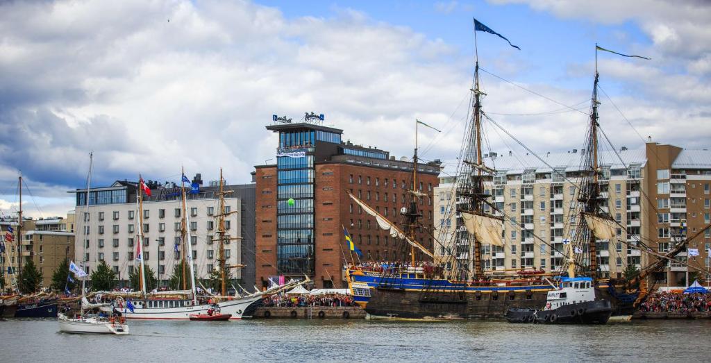 a group of boats are docked in a harbor at Radisson Blu Seaside Hotel, Helsinki in Helsinki