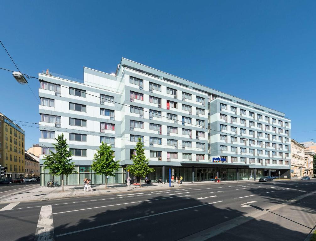 
a large building with a lot of windows at Park Inn by Radisson Linz in Linz
