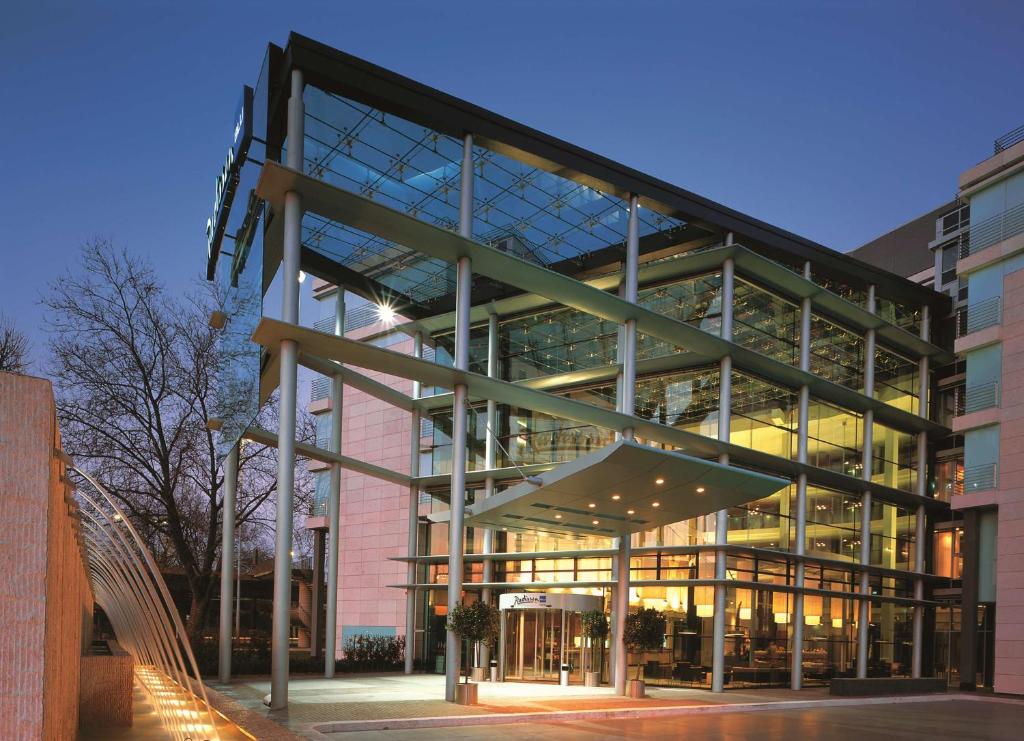 a large building with a lot of windows at Radisson Blu Hotel Köln in Cologne