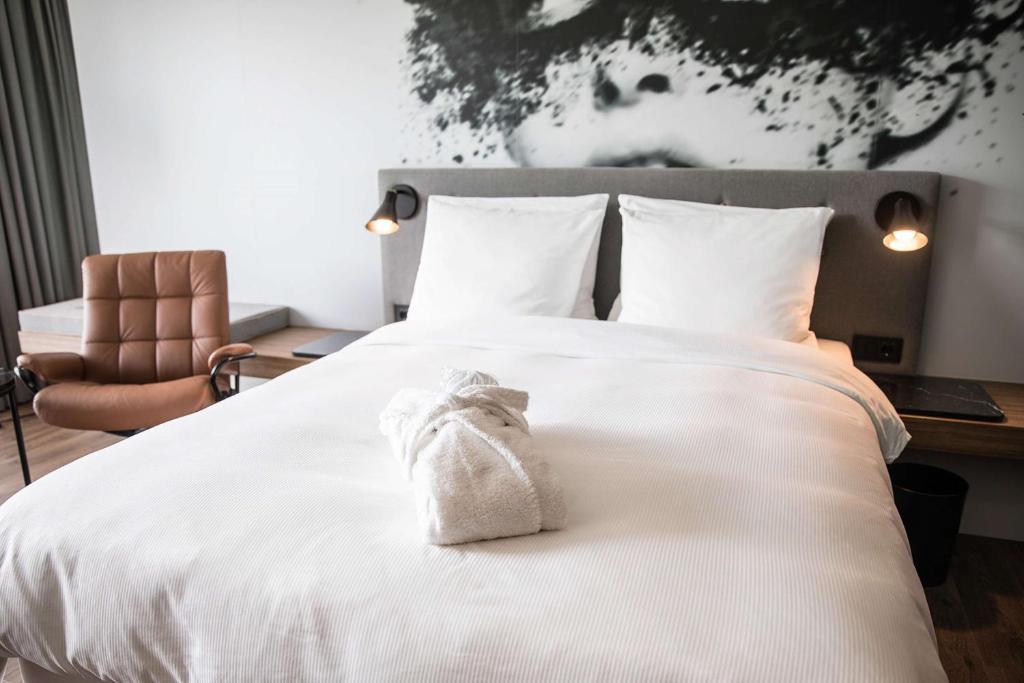 Postel nebo postele na pokoji v ubytování Radisson Blu Hotel Köln