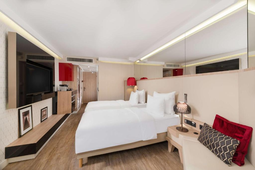 Postel nebo postele na pokoji v ubytování Radisson Blu Béke Hotel, Budapest