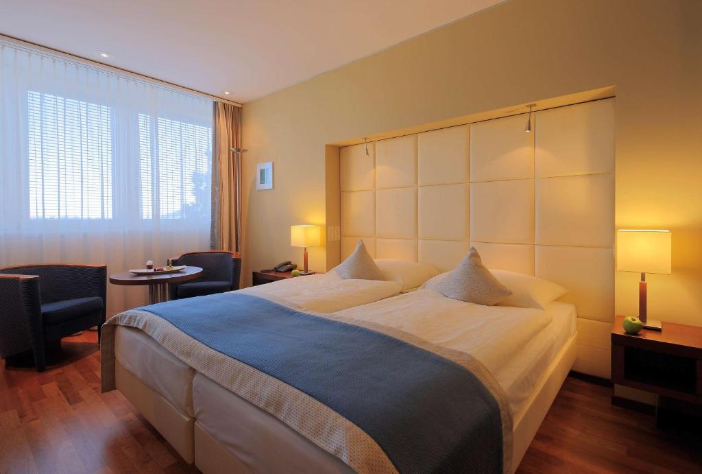 Postel nebo postele na pokoji v ubytování Radisson Blu Hotel, St. Gallen