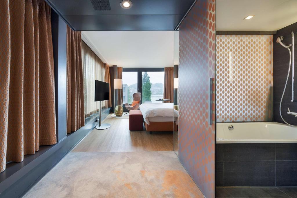 Ένα ή περισσότερα κρεβάτια σε δωμάτιο στο Radisson Blu Hotel, Lucerne