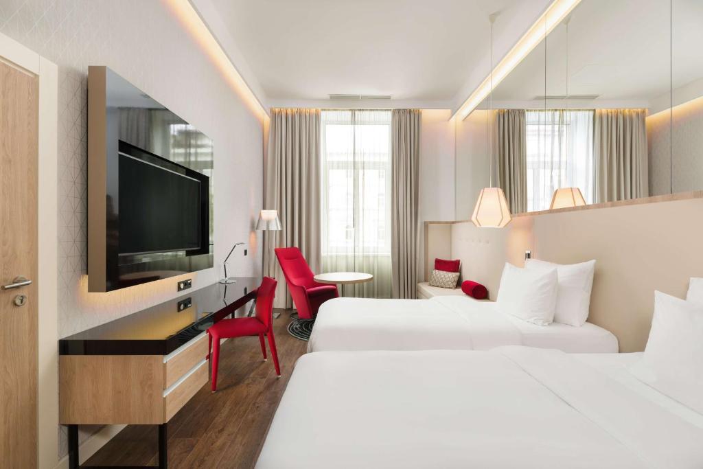 Postel nebo postele na pokoji v ubytování Radisson Blu Béke Hotel, Budapest