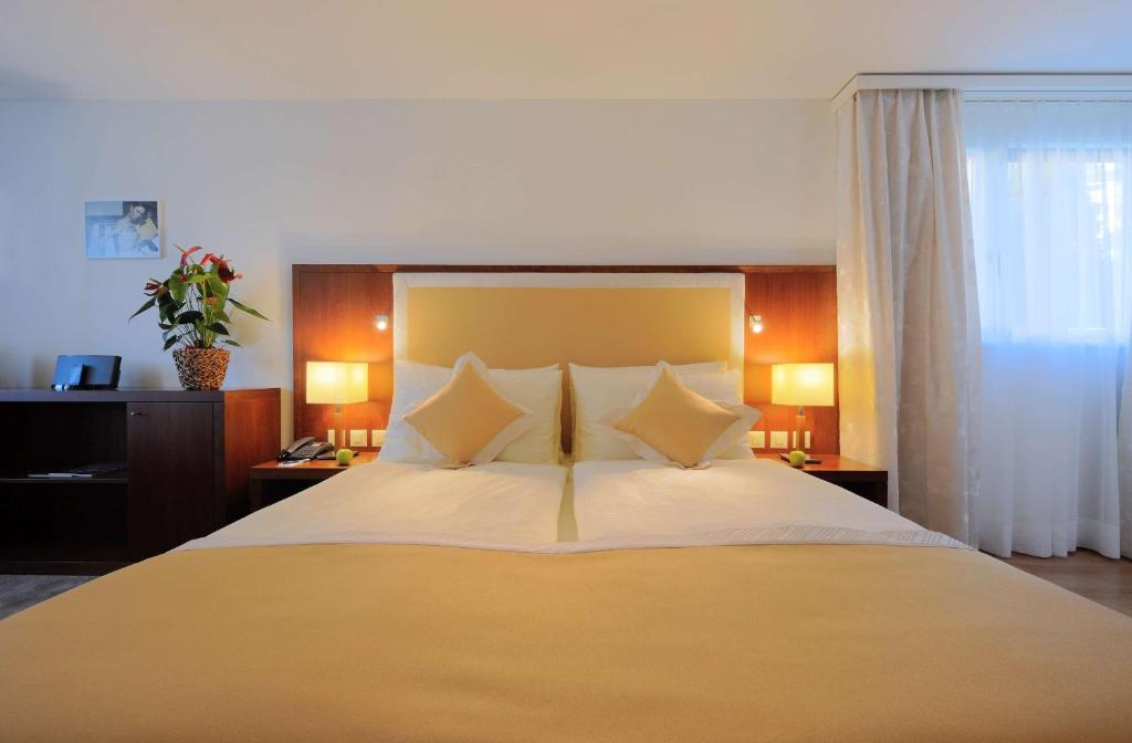 Postel nebo postele na pokoji v ubytování Radisson Blu Hotel, St. Gallen