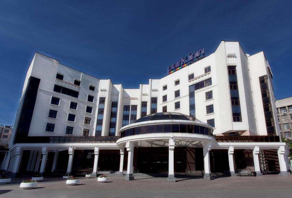 a large building with a large clock on the front of it at Park Inn by Radisson in Yekaterinburg