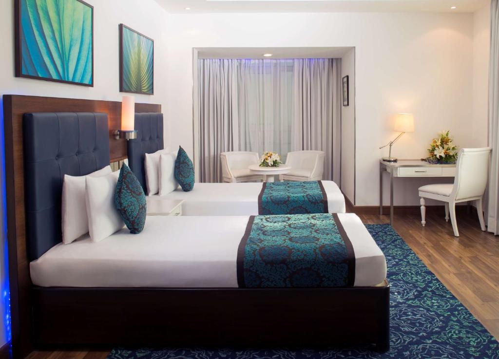 Postel nebo postele na pokoji v ubytování Radisson Blu Kochi