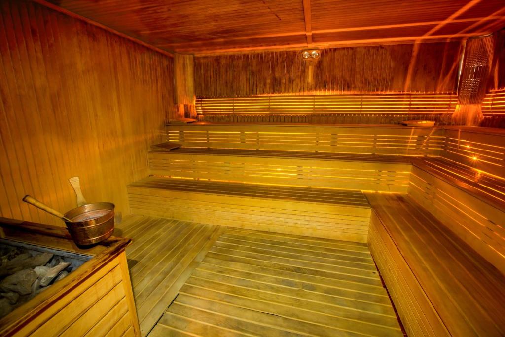 an empty sauna with a bucket in the middle at Park Inn by Radisson Istanbul Asia Kavacik in Istanbul