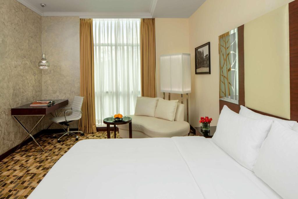 Posteľ alebo postele v izbe v ubytovaní Radisson Blu Atria Bengaluru