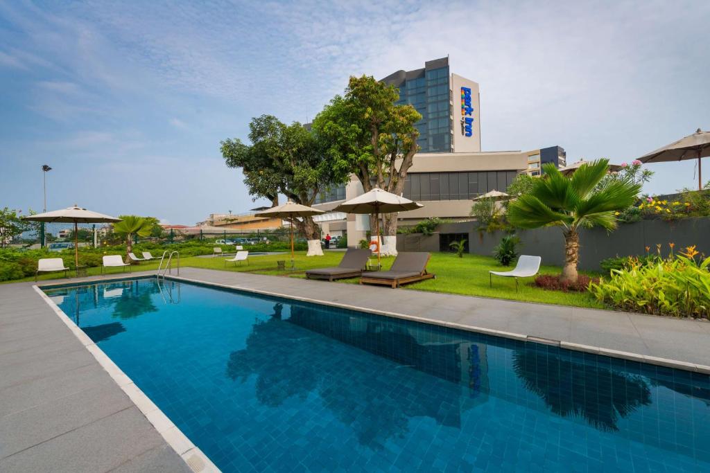 The swimming pool at or close to Park Inn by Radisson Libreville