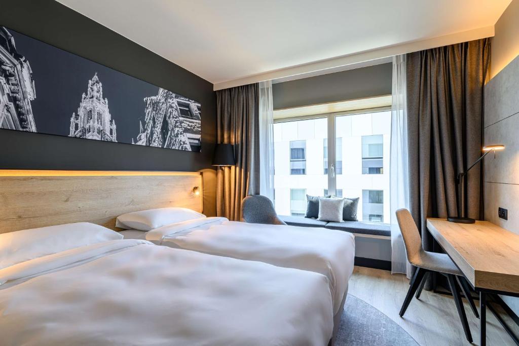 Postel nebo postele na pokoji v ubytování Radisson Hotel Antwerp Berchem