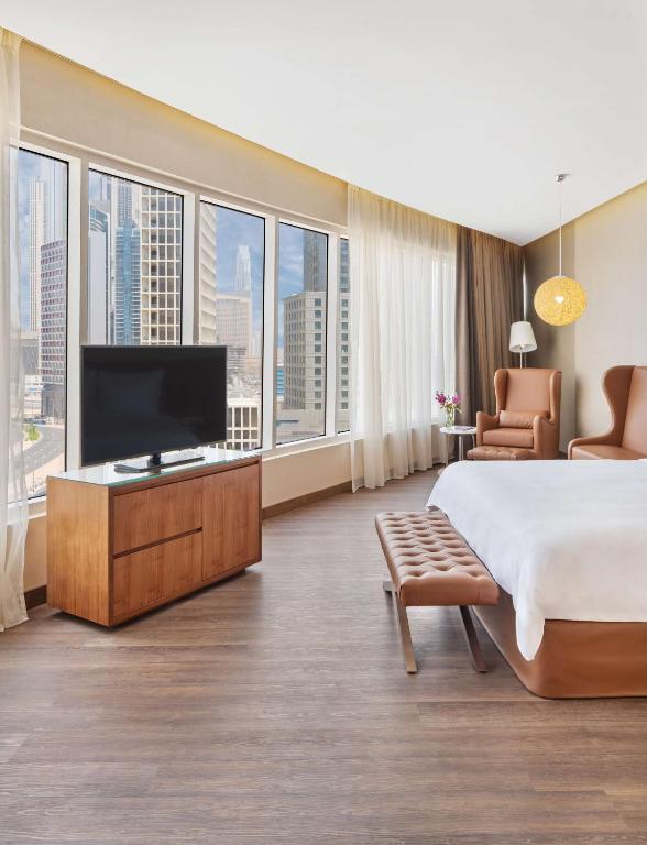 A television and/or entertainment centre at Radisson Blu Hotel, Dubai Canal View