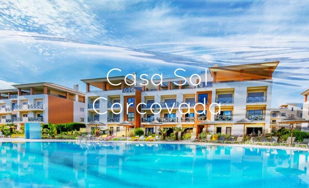 a rendering of a resort with a large swimming pool at Casa Sol Corcovada in Albufeira