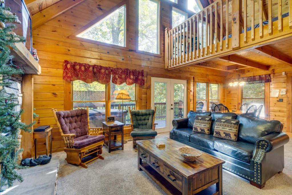 a living room with a couch and a table at Beary Comfy in Gatlinburg