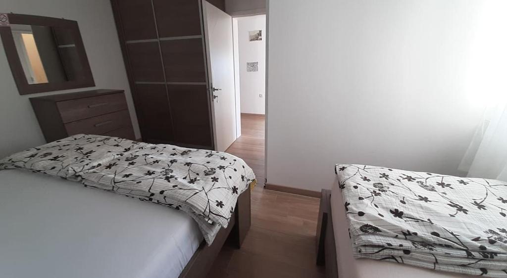 Postel nebo postele na pokoji v ubytování Apartments Villa Ravlić