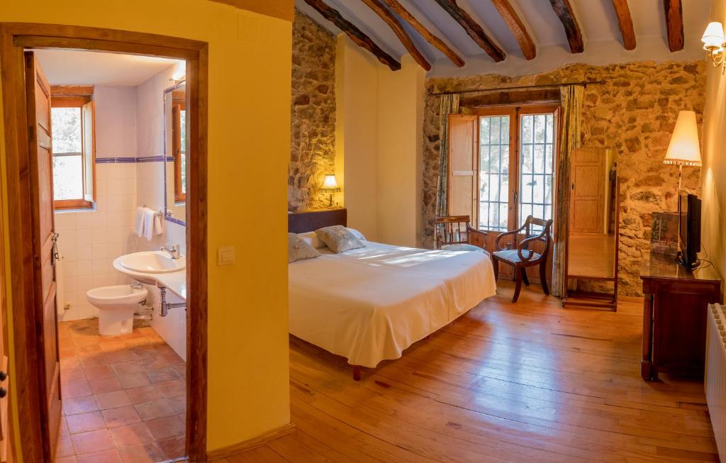 Postel nebo postele na pokoji v ubytování Hotel Rural Mas Fontanelles