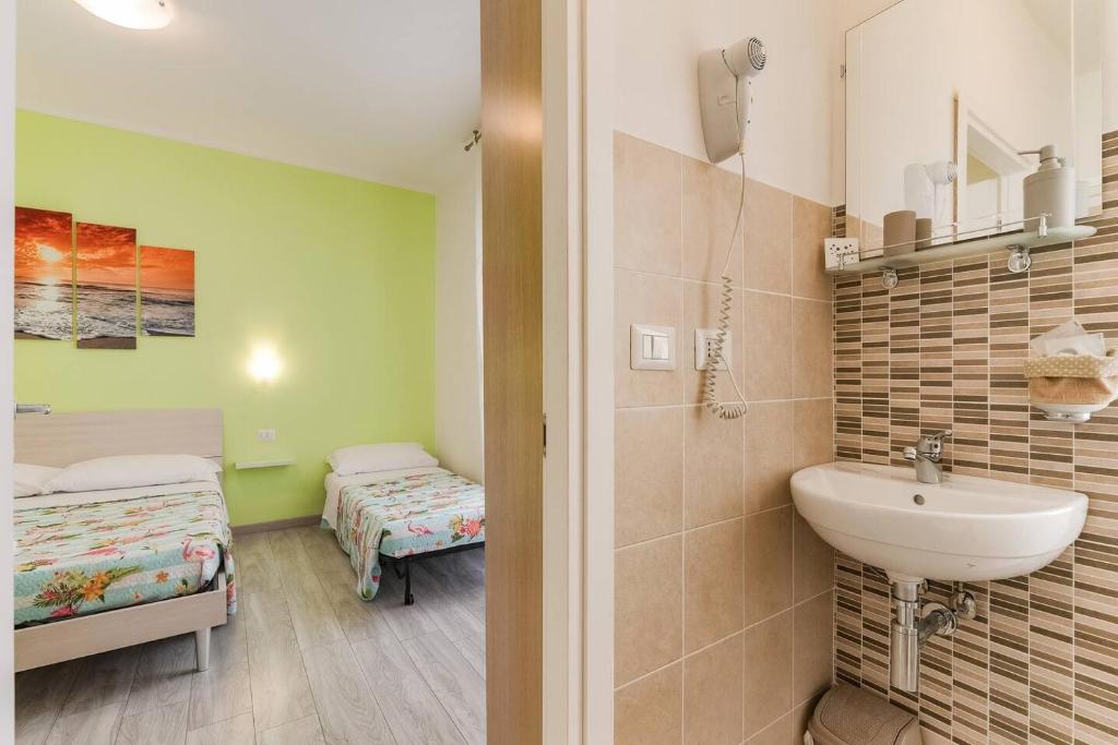 Postel nebo postele na pokoji v ubytování Leolù Guesthouse Alghero