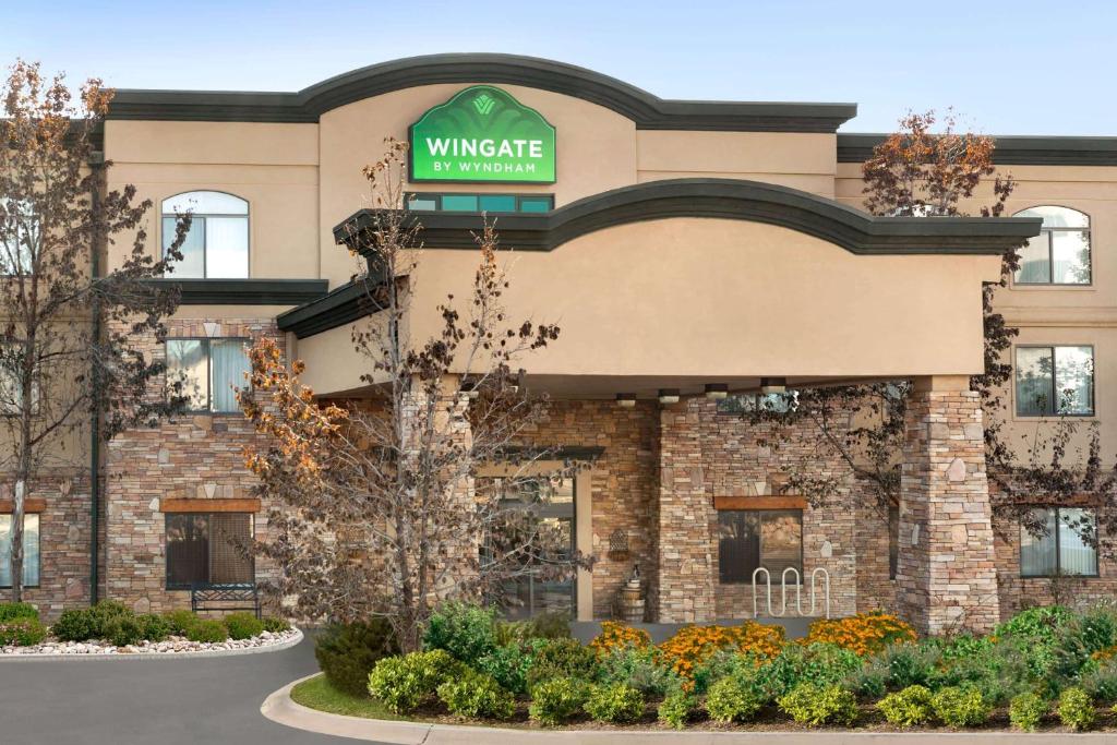a building with a sign on the front of it at Wingate by Wyndham Denver Tech Center in Greenwood Village