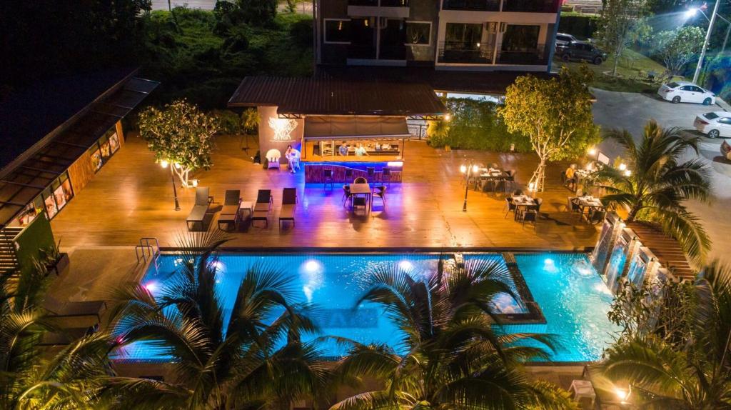 an overhead view of a swimming pool at night at River Front Krabi Hotel in Krabi