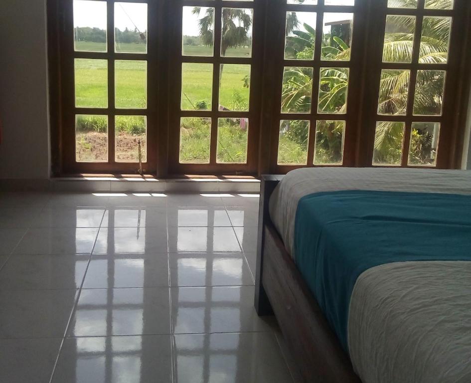 Postel nebo postele na pokoji v ubytování Andorra Tourist Resort Anuradhapura