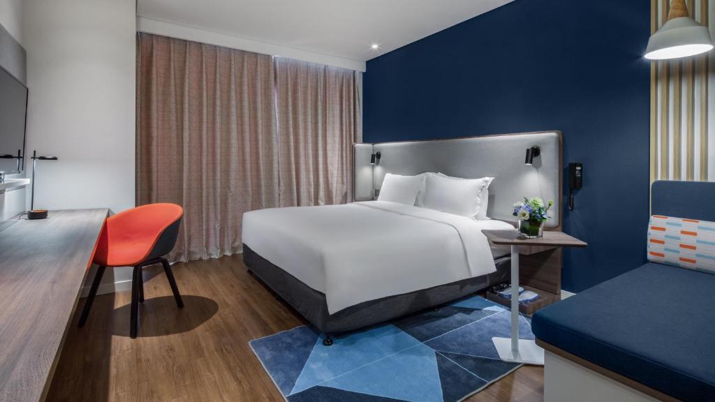 Postel nebo postele na pokoji v ubytování Holiday Inn Express Shanghai Hongqiao North by IHG