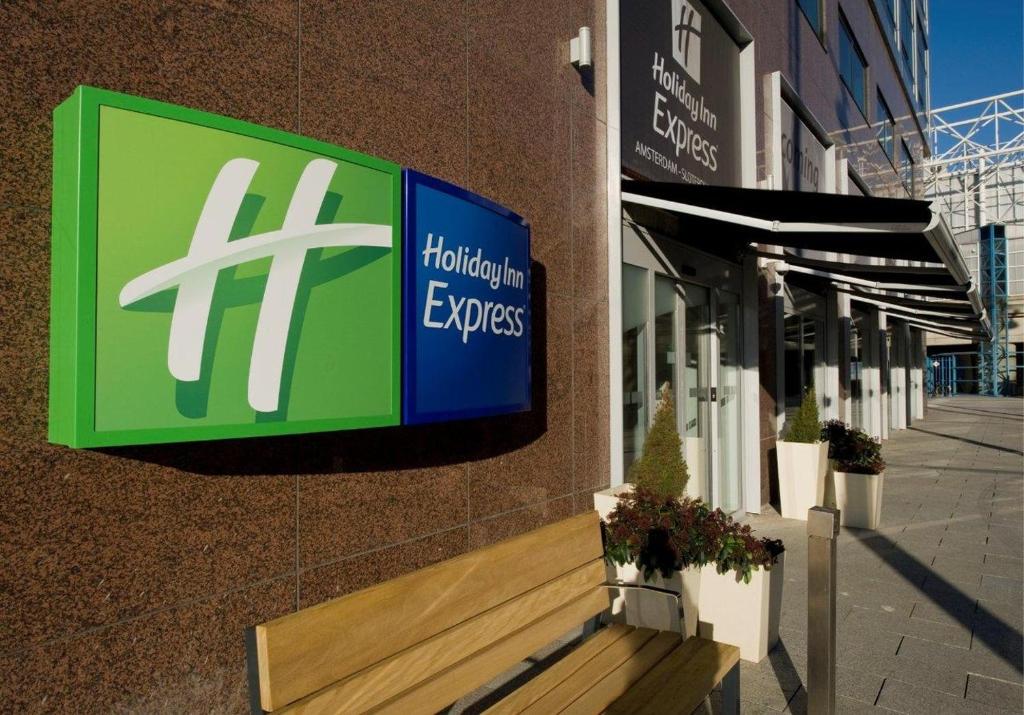 a sign on the side of a building at Holiday Inn Express Amsterdam - Sloterdijk Station, an IHG Hotel in Amsterdam
