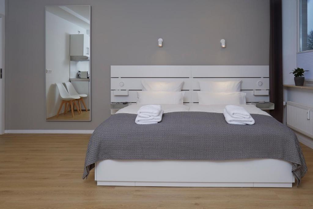 Postel nebo postele na pokoji v ubytování Hamburg Nord Apartments