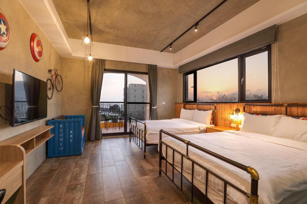 Postel nebo postele na pokoji v ubytování Shi Guang Sea View