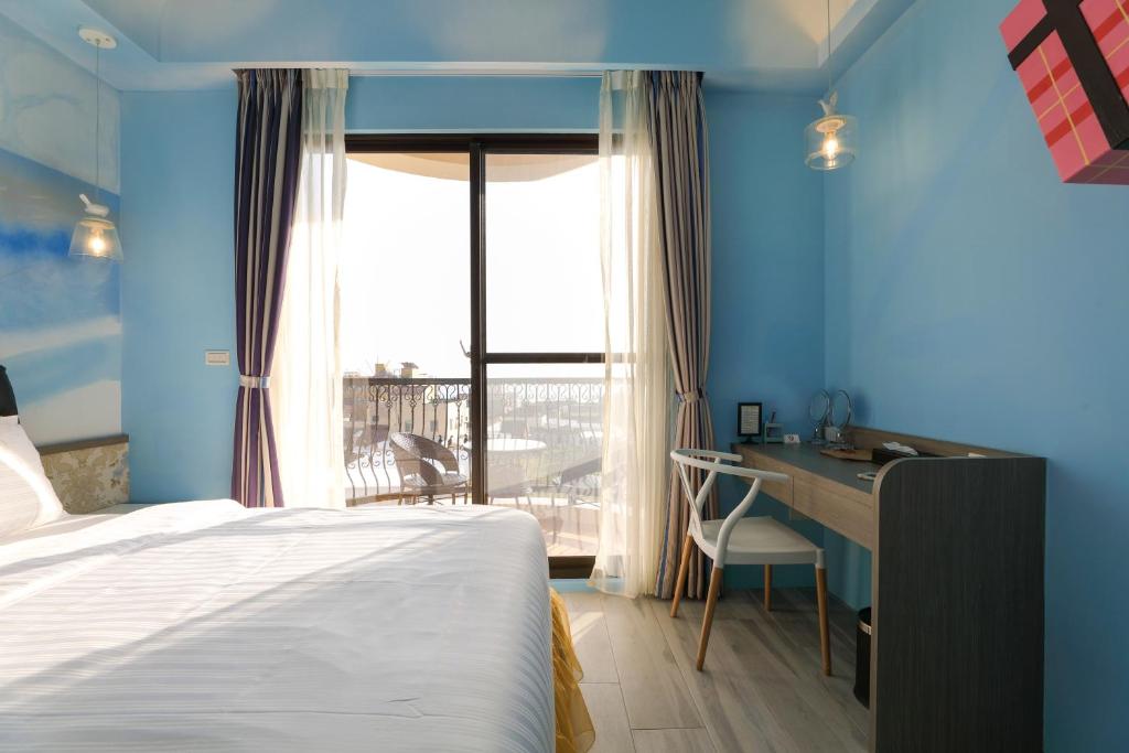 Postel nebo postele na pokoji v ubytování Shi Guang Sea View