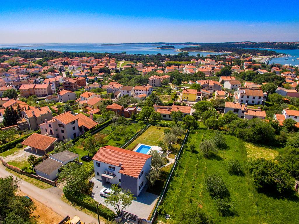 an aerial view of a residential neighborhood with houses at Luxury villa Medulin with pool near the beach , sea view, extra pool heating available in Medulin