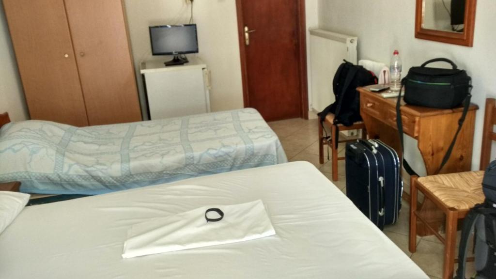 Postel nebo postele na pokoji v ubytování Hotel Marmarinos