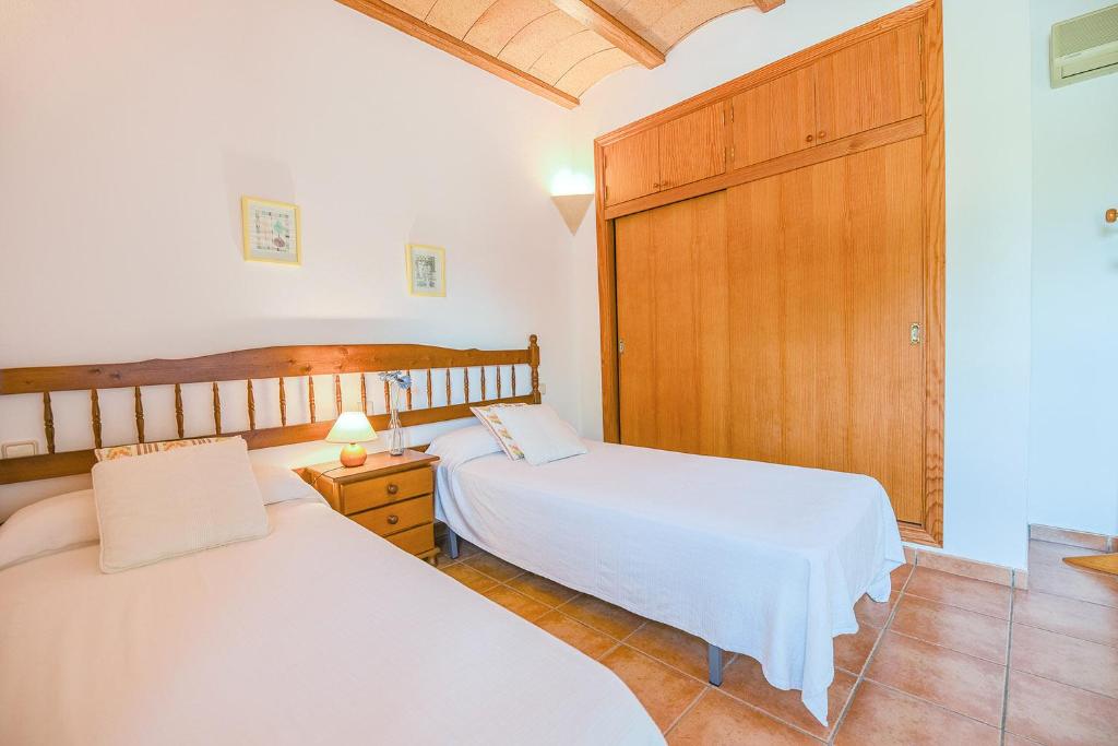 Postel nebo postele na pokoji v ubytování Mallorcan stone house Villa Matias