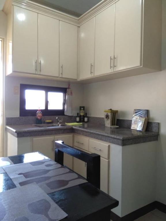 Kuchyň nebo kuchyňský kout v ubytování V.F. Riton Apartelle