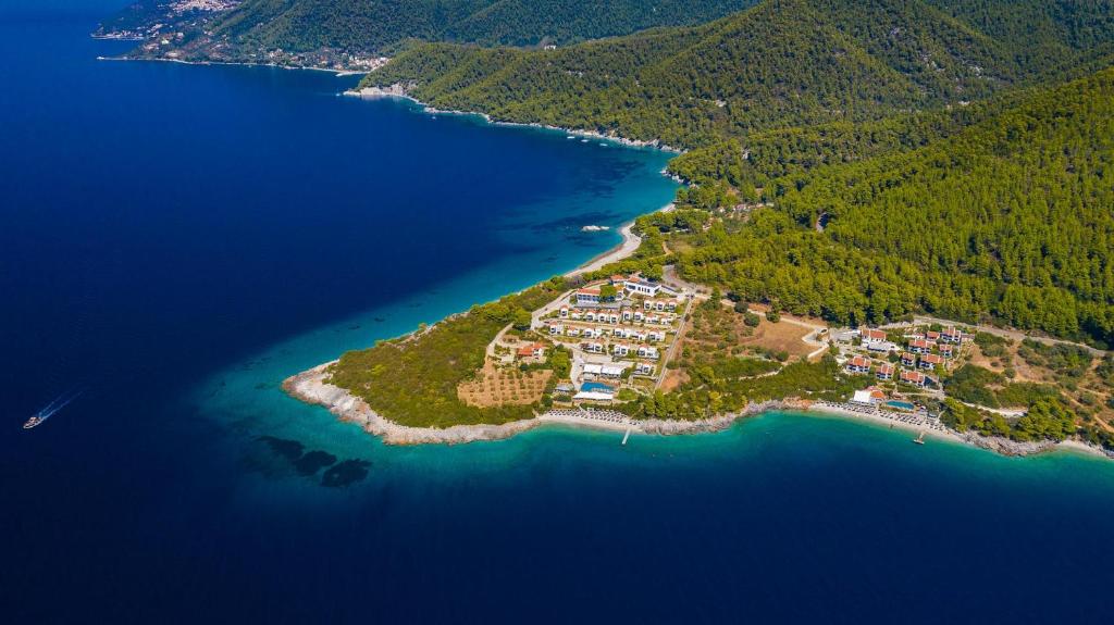 an island in the middle of a body of water at Adrina Resort & Spa in Panormos Skopelos