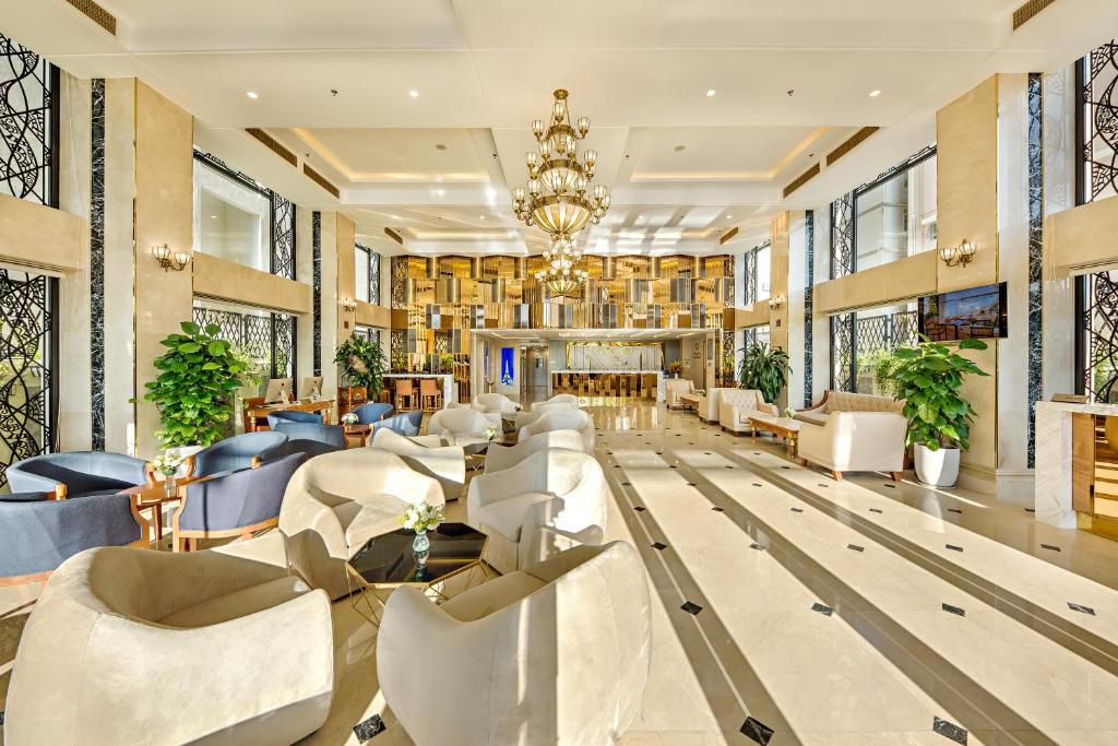 A grand lobby lounge with extensive seating and a long reception area.