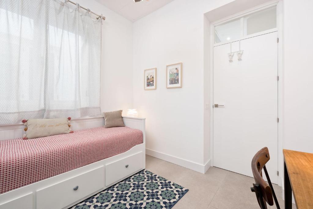 Łóżko lub łóżka w pokoju w obiekcie Casapalma Apartment in Malaga by Solaga Holiday Homes